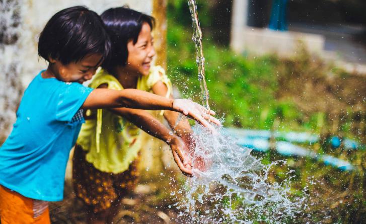 Image of children playing with water